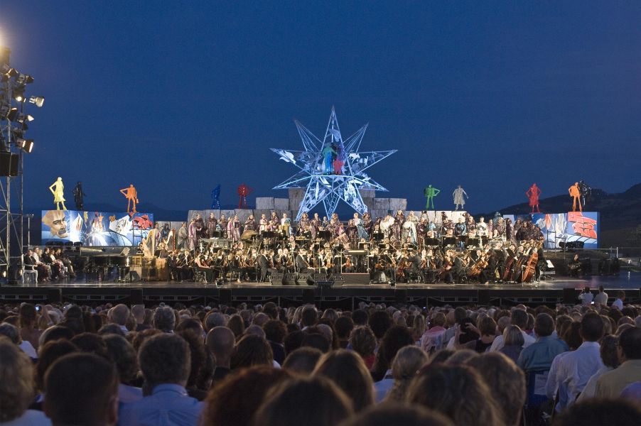 Outdoor concert with orchestra and audience